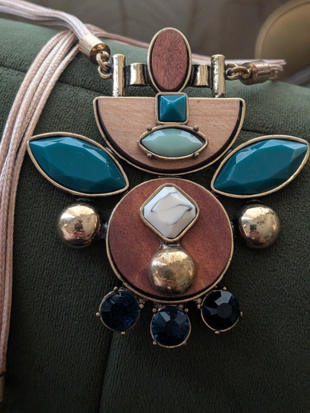 Jardim Pendant by Anthropologie features mixed materials including wood, turquoi
